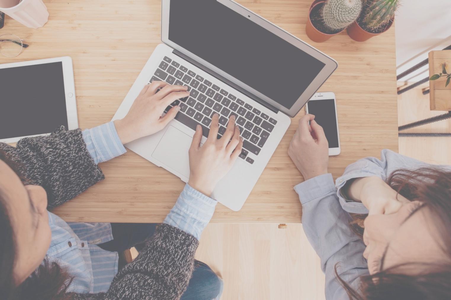 Professional financial consultation workspace with charts and analysis materials